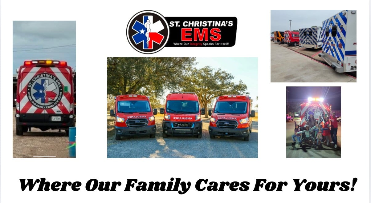 Three red St. Christina’s EMS ground ambulances lined up beneath trees